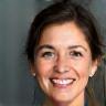 Headshot of a satisfied client, Anette Christensen, smiling.
